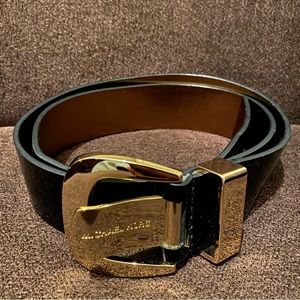 Michael Kors black belt made of synthetic materials. 42 inches in length. Size L